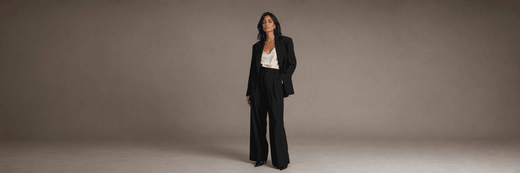 Spring wardrobe essentials on a boutique clothing rail